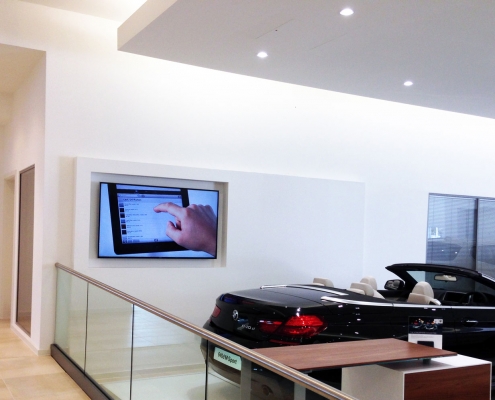 Car showroom AV install and corporate lighting solutions image